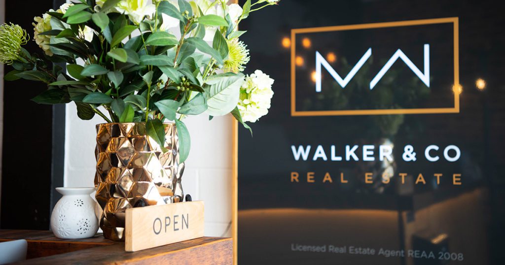 Image: Walker & Co Real Estate logo